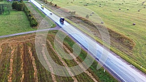 Flight over the cars. Wet road after rain. Aerial footage. Close up.