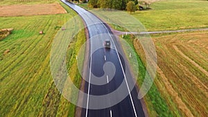 Flight over the cars. Wet road after rain. Aerial footage. Close up.