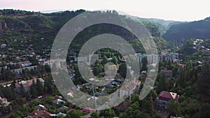 Flight over of the center city, mining town Chiatura famous for its manganese mines being situated on Kvirila river.