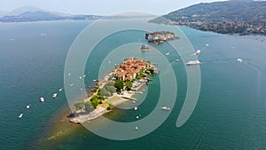 Flight over city on Maggiore lake bank