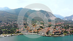 Flight over city on Maggiore lake bank