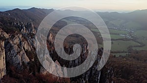 Flight over cliffs at sunset