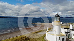 Flight over Cromarty Lighthouse at Cromarty Firth in the Scotland - aerial footage
