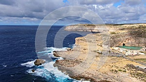 Flight over Dwerja Bay at the coast of Gozo Malta