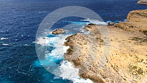 Flight over Dwerja Bay at the coast of Gozo Malta