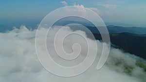 Flight over the fog over Mount Gemba. Ukrainian Carpathian Mountains.