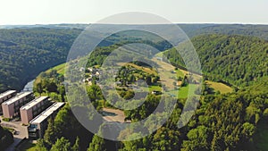 Flight over green river valley