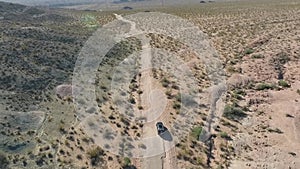 Flight over long highway at monument valley in Utah - Drone Aerial over cars in Arizona. Top view drone footage flying