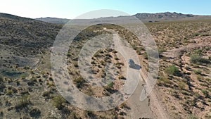 Flight over long highway at monument valley in Utah - Drone Aerial over cars in Arizona. Top view drone footage flying