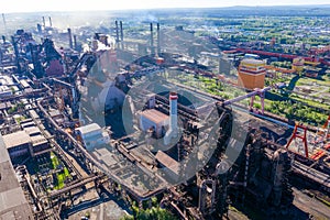 Flight over the metallurgical plant. Smoke and smog in the industrial zone.