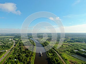 Flight over the river. Passage of hydraulic locks on the channel by commercial cargo ship