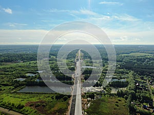 Flight over the river. Passage of hydraulic locks on the channel by commercial cargo ship