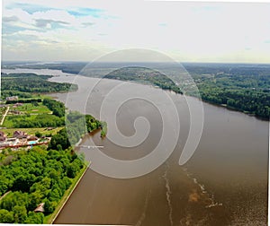 Flight over the river. Passage of hydraulic locks on the channel by commercial cargo ship