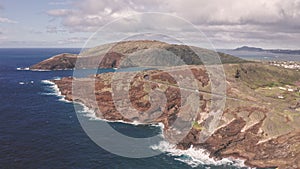 Flight over rocky coast of tropical island of Oahu Hawaii. View of Hanauma Bay. Kalanianaole Highway South Shore Oahu