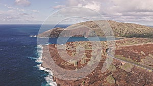 Flight over rocky coast of tropical island of Oahu Hawaii. View of Hanauma Bay. Kalanianaole Highway South Shore Oahu