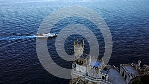 Flight over the swallow`s nest castle and the black sea at sunset