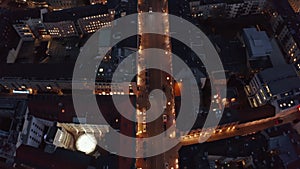 Flight over typical Neighborhood in Munich, Germany beautiful Winter Vibe at Night with City Lights and traffic glowing