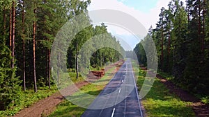 Flight over a wet forest road after rain. Evaporation.