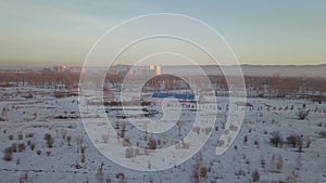 Flight over the winter field on the drone