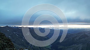 Flight past male hiker towards mountain panorama and valley during sunrise in Texel group, South Tyrol, Italy