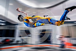 Flight. Peoples fly in wind tunnel. Indoor skydiving. Swim in wind tunnel. New sport in flight technology.