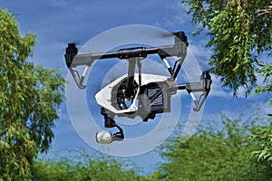 In Flight - Side View of Professional Camera Drone (UAV)