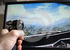 Flight simulator game and hand on joystick