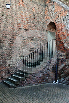 Flight of steps with metal rail.