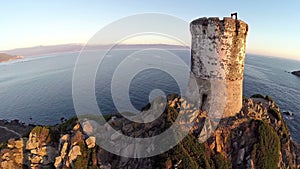 Flight and takeoff over old tower with background of the sea and islands. Tour de la Parata, Ajaccio, Corsica. Aerial pano