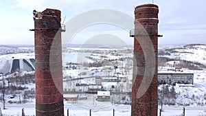 Flight between two chimneys of a metallurgical plant