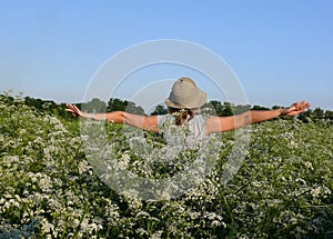 Flight on white flowers meadow. Happy and youth