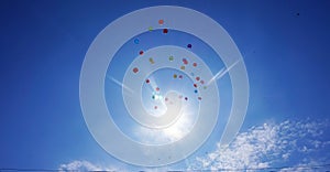 Flighting in the blue sky balloons photo