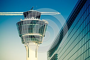 Flights management air control tower passenger terminal and flying plane photo