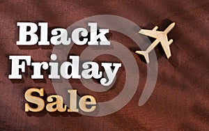 Flights in promotion - Black friday sale. Word in wooden letters