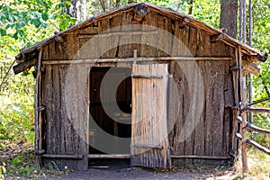 Flimsy wooden house in the forest. No people