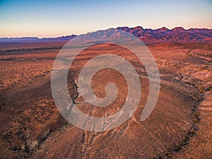 Flinders Ranges peaks at orange sunset.