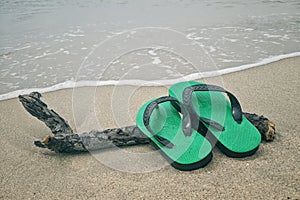 Flip-flop on the beach summer vacation, travel Concept.