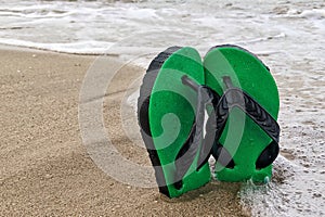 Flip-flop on the beach summer vacation, travel Concept.