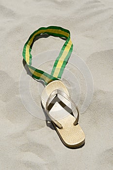 Flip Flop Gold Medal with Ribbon on Sand