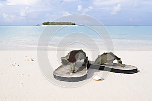 Flip-flop on white sand beach