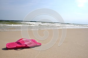 Flip flops on beach photo