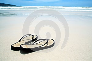 Flip flops on the beach photo