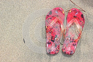 Flip Flops on the beach sand texture background