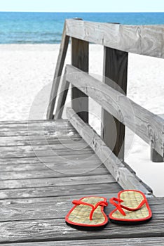 Flip flops on beach walkway