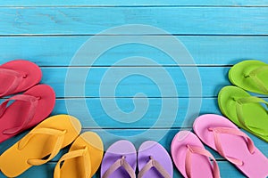 Flip flops with blue summer beach deck, copy space