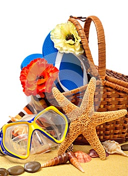 Flip-flops, fishstar, wicker basket.