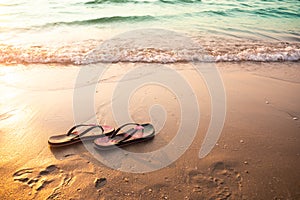 Flip flops or sandals for woman on sand beach at coast