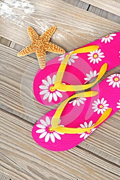 Flip flops and starfish on dock