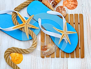 Flip-flops, starfish and seashells.