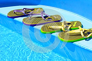 Flip-flops on the swimming pool. photo